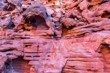 Red stones and the texture of the walls in Colored canyon, Sinai desert, Sinai peninsula, Egypt