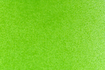macro photography of green spray paint on white paper