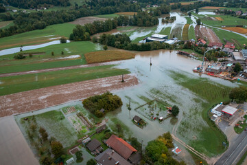 Extensive deluge across Europe, flooded mountain valley, near the households area and traffic ways,...