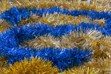 Glittering gold and blue Christmas tinsel texture background