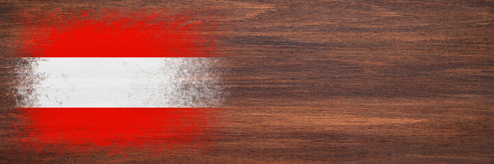 Flag of Austria. Flag is painted on a wooden surface. Wooden background. Plywood surface. Copy space. Textured background