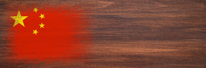 Flag of China. Flag is painted on a wooden surface. Wooden background. Plywood surface. Copy space. Textured background
