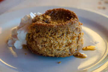 Flan pudding with cream on plate for dessert make with eggs sugar and milk Spain