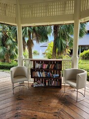 lounge chairs and bookcase in the garden