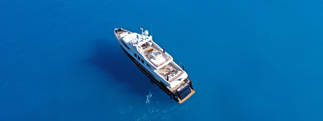 Aerial drone ultra wide panoramic photo of large luxury yacht anchored in paradise Mediterranean...