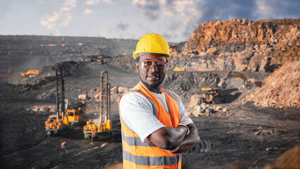 African american worker geology background big drilling yellow mining truck for coal. Concept open pit mine industry - obrazy, fototapety, plakaty