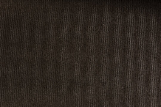 Texture of black spunbond. Close-up of black biodegradable polypropylene impregnated with spunbond for wide application.