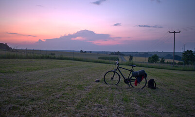 bike on the field at sunset - biking tour