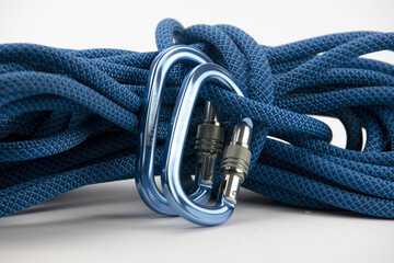 Isolated new climbing equipment - blue carabiners