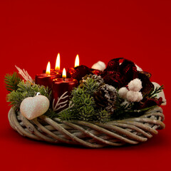 Lighting candles on the Advent Wreath on the first Sunday in December to celebrate the beginiing of Christmas holidays
