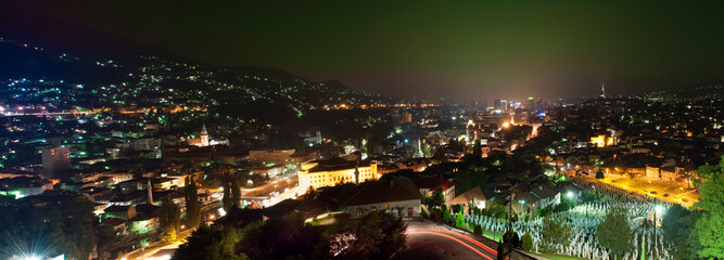 Obraz premium Cityscape of Sarajevo town at night. Bosnia and Herzegovina. Popular travel destination. City by night. Grave.