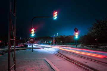 long exposure of stop lights in a winter night