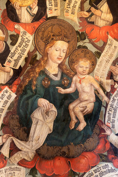 BERN, SWITZERLAND - JUNY 27, 2022: The detail of fresco of Madonna among the Dominican sanits in the church Franzosichche Kirche by anonym Nelkenmeister (1495-1500).