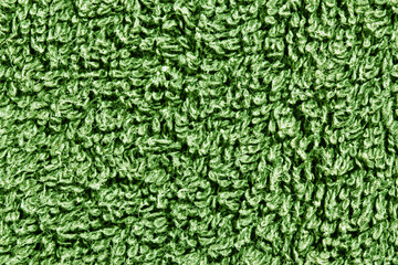Green towel texture. Macro fiber pattern. Soft cotton textile material background. Absorbent fluffy...