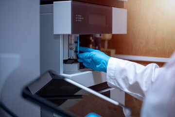 Scientist performs maintenance checks of the analytical instrument, Liquid Chromatography Mass...
