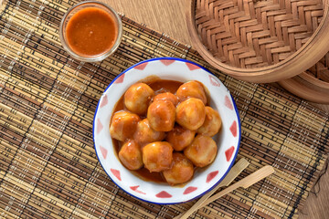 cilok is an abbreviation of aci dicolok or poked tapioca, since the tapioca balls are poked with...