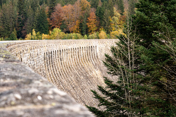 View of the top of a dam with the curvature in the black forest