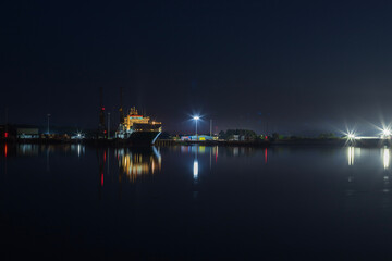 An industrial ship at night
