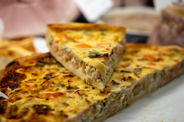 Traditional French quiche vegetable pie with green courgette and carrot