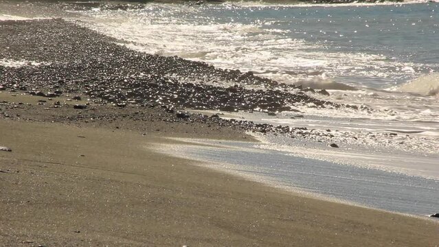 Waves Splash On A Santorini Windy Black Beach