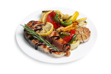Tasty salmon steak with sauce, lemon and vegetables on white background