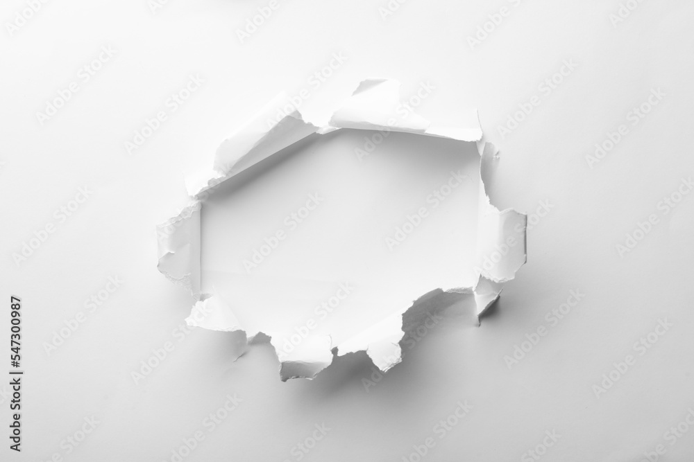 Sticker Hole in white paper on light background