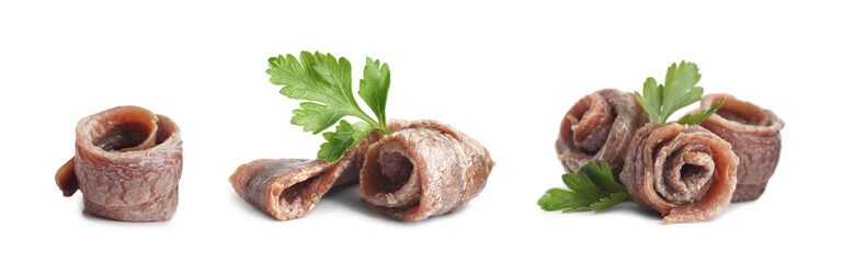 Set with delicious rolled anchovy fillets on white background. Banner design