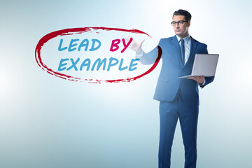 Businessman in lead by example concept