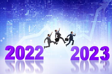 Businessman jumping from the year 2022 to 2023