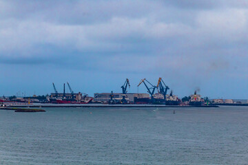 pier with ships in a cloudy day, boca del rio veracruz 