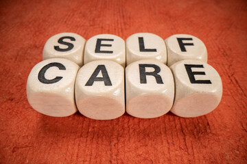 self care text in letter cubes, macro shot, health and lifestyle concept