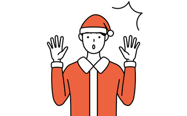 驚いて手を上げるサンタクロース姿の男性