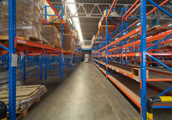 Interior of large warehouse retail store industry. Rack of furniture and home accessories stock storage. Interior of cargo in ecommerce and logistic concept. Depot