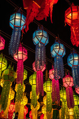 Colorful lanterns Hanging on a wire in the temple of Lamphun, Thailand in the Lantern Festival.