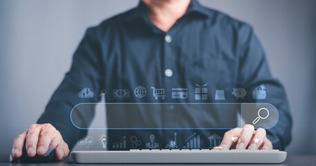 A young man searches for information that interests him through online websites, keyword search...