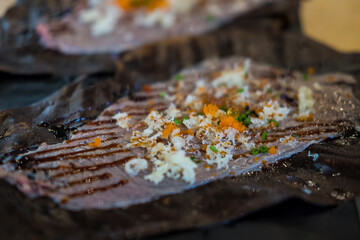 Close up Wagyu Hoba Yaki beef grilled on dried leaf. Japanese food style.