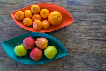 Organic Apples oranges and mandarins in trays