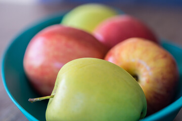 Bowl of fresh organic juicy apples