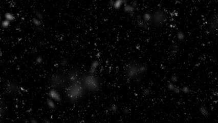 Falling snow flakes, Flying dust particles on a black background. Abstract winter background. Winter landscape with falling shining beautiful snow. 