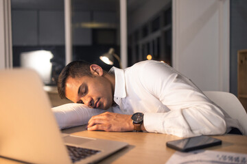 Work fatigue, business man and sleeping office employee feeling burnout from night deadline. Sleep of a digital finance worker working late on a computer with technology tired of online fintech work