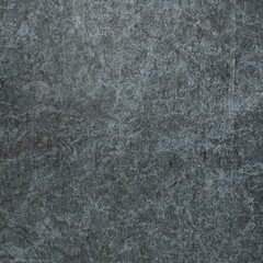 A complex texture of gray granite with a special pattern. Closeup