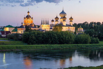Fototapeta na wymiar View of the ancient Tikhvin Assumption Monastery in August twilight. Leningrad region, Russia