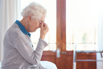 Senior woman, headache and stress with anxiety in retirement house, lonely and sad with mental...