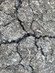 The texture is broken into pieces of asphalt of Old road