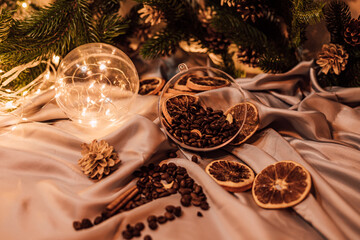 Christmas composition with coffee beans, dried oranges and garland