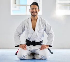 Gordijnen Karate, fitness and athlete, man with black belt and martial arts portrait, training and discipline with exercise. Taekwondo, combat sport and active with power and strong, sports motivation in dojo. © Irshaad M/peopleimages.com