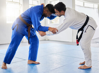 Karate, martial arts and men fighting in dojo for sports and health with discipline and balance in...