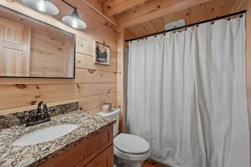 Bathroom interior of log cabin in mountains