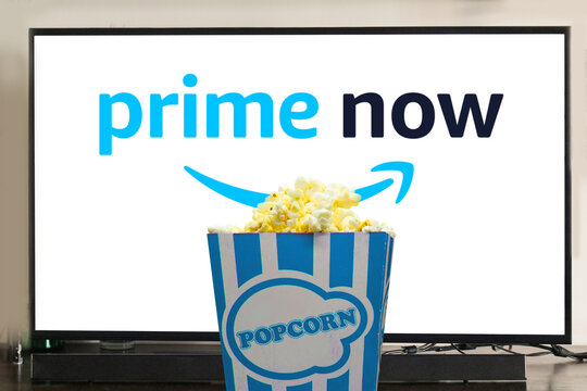 MADURAI, INDIA, 19TH NOVEMBER 2022: Amazon Prime Video logo displayed in television with popcorn in front. watching movies and series on tv concept. illustrative editorial. 
