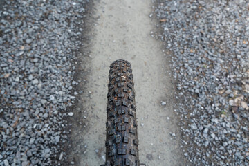 Mountain bike tires on a gravel road